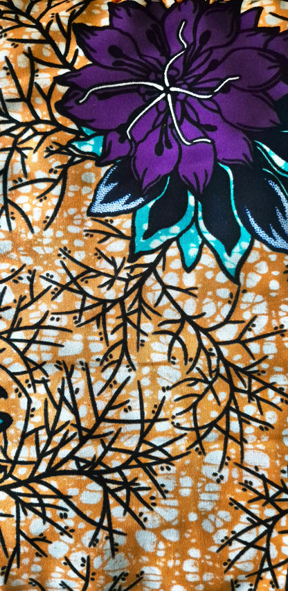 Pochette « Émeraude Mystique » – Fait main en wax africain floral violet & orangé